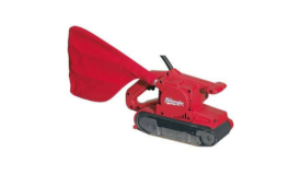 a red milwaukee belt sander against a white background